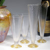 Clear and gold flutes and wine cups